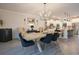 Elegant dining room with a modern chandelier, stylish chairs, and warm lighting, perfect for gatherings at 780 Old Murrells Inlet Rd., Murrells Inlet, SC 29576