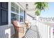 Charming front porch with comfortable seating and stylish hanging ferns at 780 Old Murrells Inlet Rd., Murrells Inlet, SC 29576