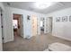 Bright hallway featuring neutral walls, carpet, and doorways leading to various rooms at 780 Old Murrells Inlet Rd., Murrells Inlet, SC 29576