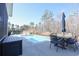 Relaxing pool with an outdoor dining area surrounded by lush greenery and trees, creating a serene atmosphere at 780 Old Murrells Inlet Rd., Murrells Inlet, SC 29576