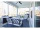 Cozy screened porch with a seating area and a view of the lush landscape at 780 Old Murrells Inlet Rd., Murrells Inlet, SC 29576