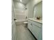 Bathroom featuring a shower-tub combo, white vanity, and tile flooring at 8628 Farrier Dr., Myrtle Beach, SC 29588