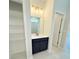 Bathroom with a black vanity, stylish lighting, tile flooring, and wire shelving at 8628 Farrier Dr., Myrtle Beach, SC 29588
