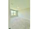 Bright, unfinished bedroom with a large window overlooking the neighborhood, ready for personalization and design at 8628 Farrier Dr., Myrtle Beach, SC 29588