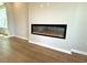 Modern linear fireplace with amber flame effect set in a neutral wall at 8628 Farrier Dr., Myrtle Beach, SC 29588