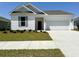 Charming single-story home featuring a well-manicured lawn and an attached two-car garage at 8628 Farrier Dr., Myrtle Beach, SC 29588