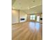 Open living area featuring an electric fireplace and ample natural light at 8628 Farrier Dr., Myrtle Beach, SC 29588