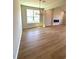 Bright, spacious living room with luxury vinyl flooring and a modern fireplace at 8628 Farrier Dr., Myrtle Beach, SC 29588