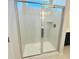 Modern bathroom showcasing a glass-enclosed tile shower with built-in shelf at 8628 Farrier Dr., Myrtle Beach, SC 29588
