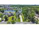 An aerial view of a home nestled on a waterfront property with lush landscaping and a long driveway at 9785 Anchor Dr., Longs, SC 29568