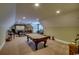 Large finished basement area with a pool table and home theater setup at 9785 Anchor Dr., Longs, SC 29568