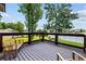 Outdoor deck overlooking lush greenery and a body of water at 9785 Anchor Dr., Longs, SC 29568