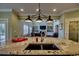 Spacious kitchen island with granite countertops, seating, and ample natural light at 9785 Anchor Dr., Longs, SC 29568