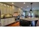 Spacious kitchen featuring granite countertops, stainless steel appliances, and ample cabinet space at 9785 Anchor Dr., Longs, SC 29568