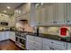 Kitchen featuring stainless steel appliances, granite countertops, and custom cabinetry at 9785 Anchor Dr., Longs, SC 29568