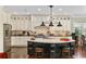 Beautiful kitchen with custom cabinetry, granite countertops, and an island with seating at 9785 Anchor Dr., Longs, SC 29568