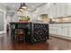 Kitchen island featuring a wine rack and seating, perfect for entertaining at 9785 Anchor Dr., Longs, SC 29568