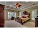 Tranquil bedroom with a decorative ceiling fan, plantation shutters, and plenty of natural light at 9785 Anchor Dr., Longs, SC 29568