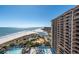 Breathtaking aerial view of the beachfront property with pools, ocean views, and well-manicured grounds at 100 N Beach Blvd. # 1608, North Myrtle Beach, SC 29582