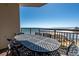Balcony with outdoor table, chairs, and panoramic ocean views for relaxed outdoor living at 100 N Beach Blvd. # 1608, North Myrtle Beach, SC 29582