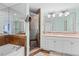 Bathroom features a double sink, tiled shower, tub, and ample mirror space at 100 N Beach Blvd. # 1608, North Myrtle Beach, SC 29582