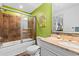 Bathroom with shower, vanity, and bright green walls at 100 N Beach Blvd. # 1608, North Myrtle Beach, SC 29582