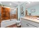 Bright bathroom featuring shower/tub combo with sliding glass door and a vanity at 100 N Beach Blvd. # 1608, North Myrtle Beach, SC 29582