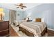 This bedroom has two twin beds, wood floors, light blue walls and ceiling fan at 100 N Beach Blvd. # 1608, North Myrtle Beach, SC 29582