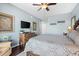 Comfortable bedroom with a soft patterned bed, wood floors and a mounted TV at 100 N Beach Blvd. # 1608, North Myrtle Beach, SC 29582