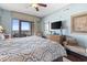 Well-lit bedroom featuring a comfortable bed, balcony access, and views of the ocean at 100 N Beach Blvd. # 1608, North Myrtle Beach, SC 29582