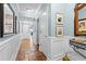 Hallway with neutral paint, tiled floors, and views into living spaces at 100 N Beach Blvd. # 1608, North Myrtle Beach, SC 29582
