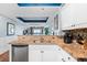 This kitchen features stainless steel appliances, light wood counters, and bar seating at 100 N Beach Blvd. # 1608, North Myrtle Beach, SC 29582