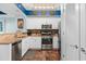 This kitchen has white cabinets, stainless steel appliances, and a unique backsplash at 100 N Beach Blvd. # 1608, North Myrtle Beach, SC 29582