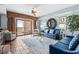 Stylish living room with comfortable seating, ocean view balcony, and elegant decor for relaxation at 100 N Beach Blvd. # 1608, North Myrtle Beach, SC 29582