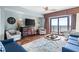 Bright living room boasts stylish furnishings, decor, and access to an oceanfront balcony at 100 N Beach Blvd. # 1608, North Myrtle Beach, SC 29582