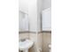 Bathroom features a pedestal sink, mirror, and tiled walls with a decorative border at 1019 Prince St., Georgetown, SC 29440