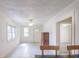 Bright and airy living room with tile flooring, ceiling fan, and windows providing ample natural light at 1019 Prince St., Georgetown, SC 29440