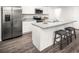 Modern kitchen features stainless steel appliances, granite countertops and a cozy island with bar stool seating at 1108 Oak Meadow Dr., Conway, SC 29526