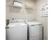 Well-equipped laundry room with a modern washer and dryer, plus ample shelving at 1108 Oak Meadow Dr., Conway, SC 29526