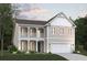 Charming two-story home featuring double balconies, a two-car garage, and craftsman-style details at 115 Northbrook Dr, Murrells Inlet, SC 29576
