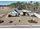 New construction home featuring modern farmhouse architecture, a landscaped yard, and a paved driveway on a spacious lot at 115 Northbrook Dr, Murrells Inlet, SC 29576