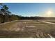 A spacious land lot ready for construction in a developing community featuring trees in background at 115 Northbrook Dr, Murrells Inlet, SC 29576