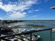 Picturesque waterfront view features a marina, various boats, and a stunning bridge under a bright, partly cloudy sky at 115 Northbrook Dr, Murrells Inlet, SC 29576