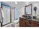 Bathroom with vanity, shower and toilet; walls painted a nice two tone blue at 120 Swallowtail Ct., Little River, SC 29566