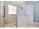 Barrier free shower equipped with safety rails, a shower seat, and decorative window at 120 Swallowtail Ct., Little River, SC 29566