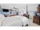 Spacious bedroom with light-blue walls, sitting area and a four-poster bed with white bedspread at 120 Swallowtail Ct., Little River, SC 29566