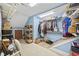 Walk-in closet featuring plenty of hanging storage and shelving, painted in pleasing light blue at 120 Swallowtail Ct., Little River, SC 29566