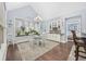 Bright dining room with a large window, stylish chandelier, and easy access to the bar and bedroom at 120 Swallowtail Ct., Little River, SC 29566