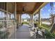 Charming covered front porch with a ceiling fan and beautiful views of the landscaped front yard at 120 Swallowtail Ct., Little River, SC 29566