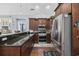 Well-equipped kitchen featuring stainless steel appliances, granite counters, and dark wood cabinetry at 120 Swallowtail Ct., Little River, SC 29566